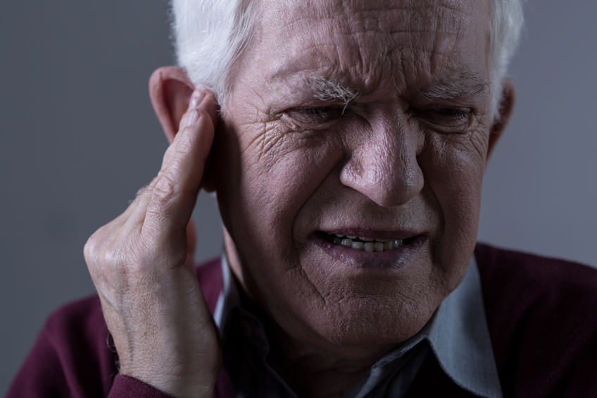 Old man suffer from tinnitus