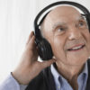 Closeup of a senior man wearing headphones