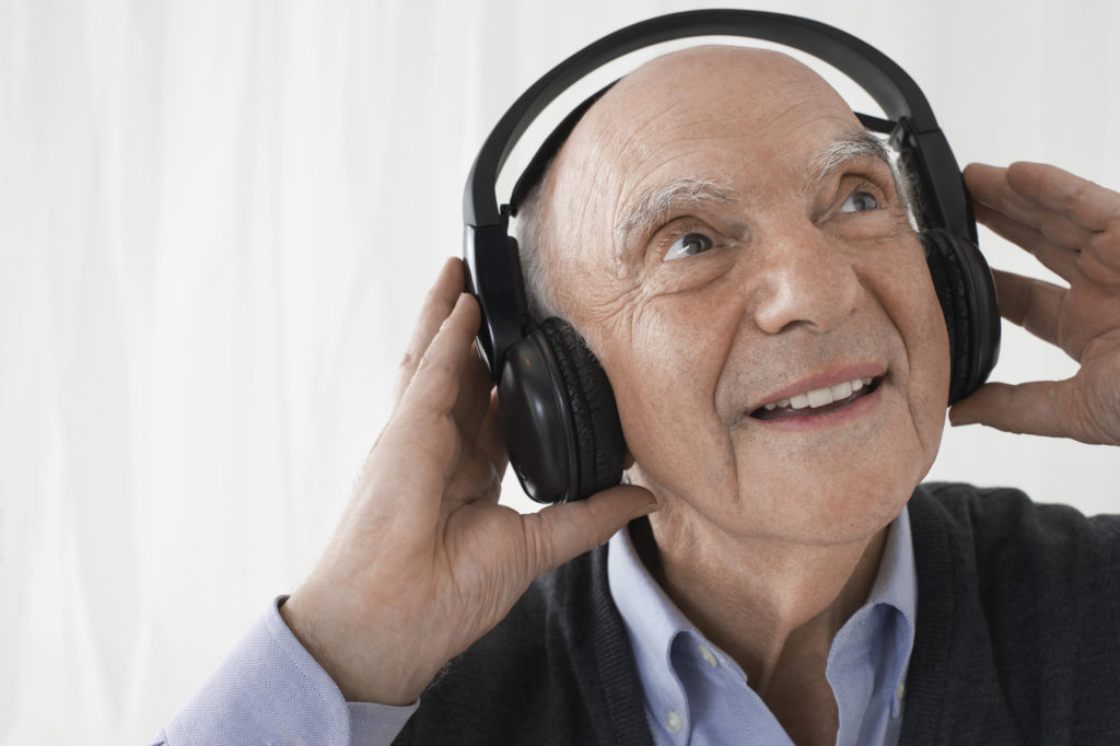 Closeup of a senior man wearing headphones